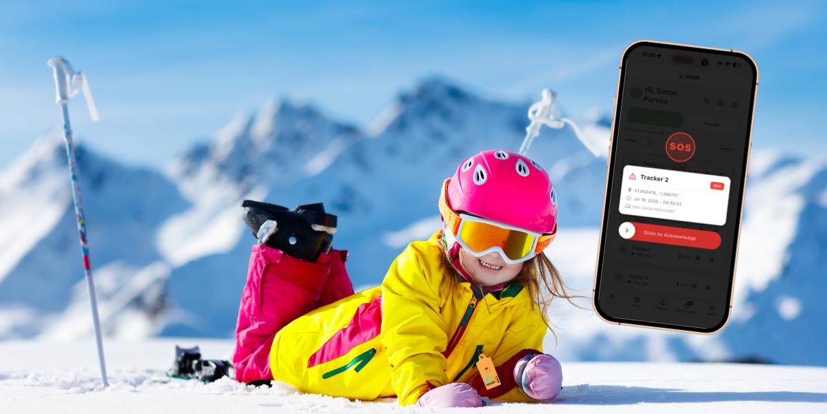 Young skier smiling in the snow, with the MeiliGPS app on a parent's phone ready to show an SOS alert