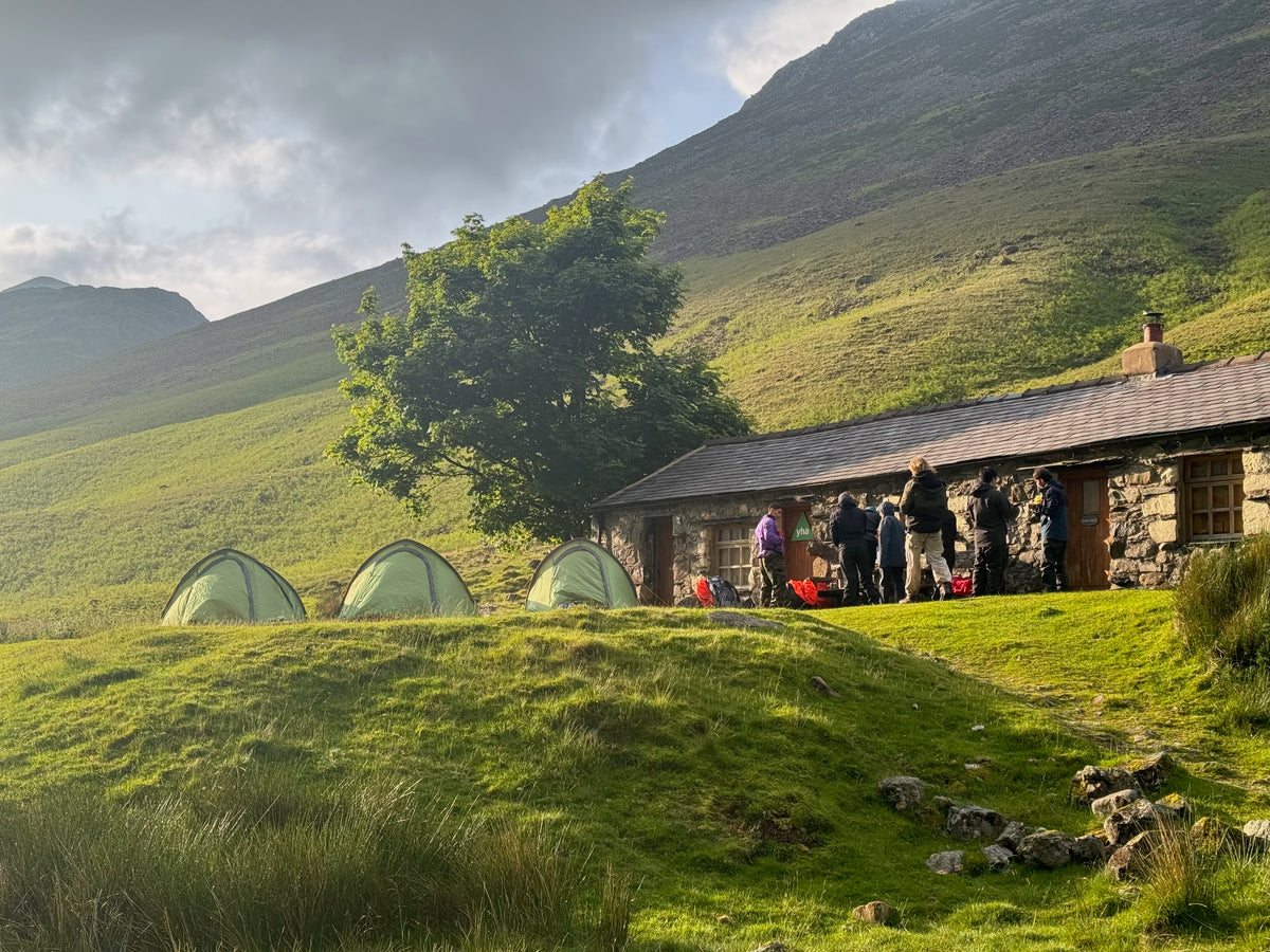 DofE expedition group gathering outside a youth hostel before setting off, with their leaders